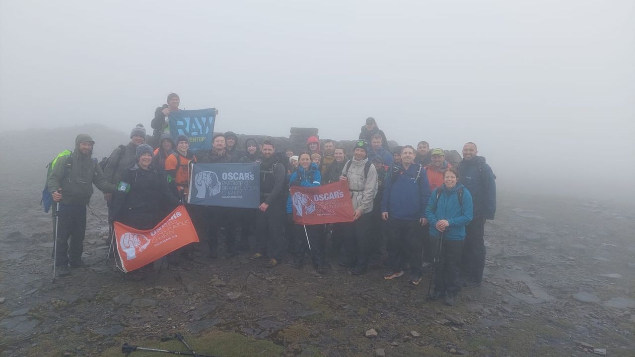 The first group to complete the challenge, pictured here at the summit of Ingleborough