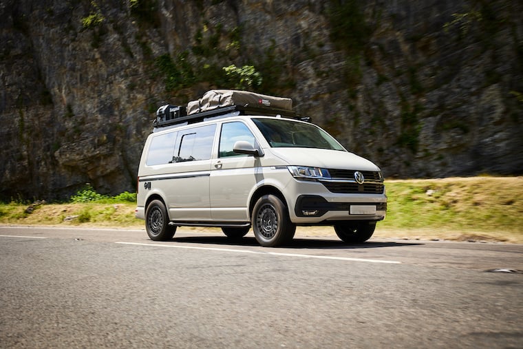 Campervan surrounded by cliffs