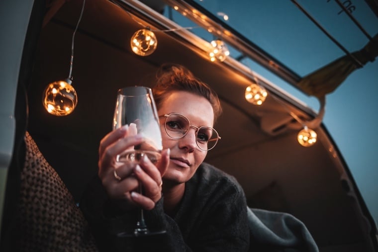 Girl At Night In Campervan with Fairy Lights