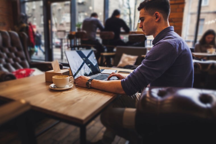 Man on a laptop in cafe