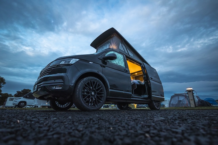 A campervan light in the evening with pop top raised