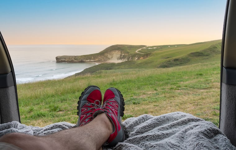 Person looking out from campervan