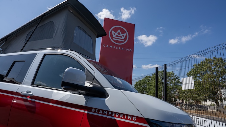 A red and white coloured VW T7 campervan at CamperKing's Surrey showroom