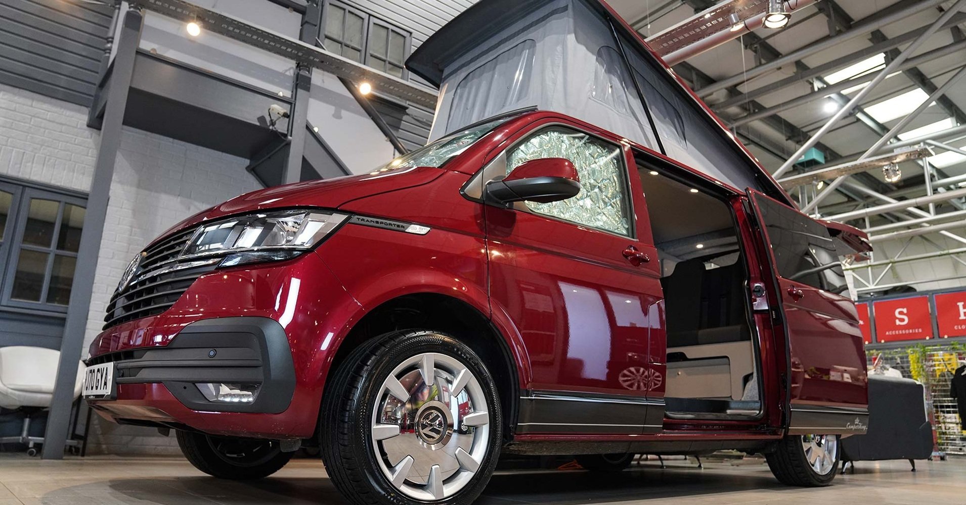 red campervan in camperking hq showroom